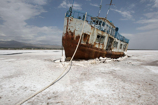 An abandoned ship is stuck in the solidified salts of the Oroumieh Lake, Iran. Environmentalists and activists have been raising alarms for years that the lake is threatened by drought and aggressive agriculture policies. Vahid Salemi / AP