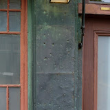 Pock-marks from bomb sharpnel - copper sheathing on some buildings provided a small degree of protection during WWII Pock-marks from bomb sharpnel - copper sheathing on some buildings provided a small degree of protection during WWII