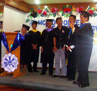 Sir Jerome receives his Salutatorian (silver) medal together with his father.