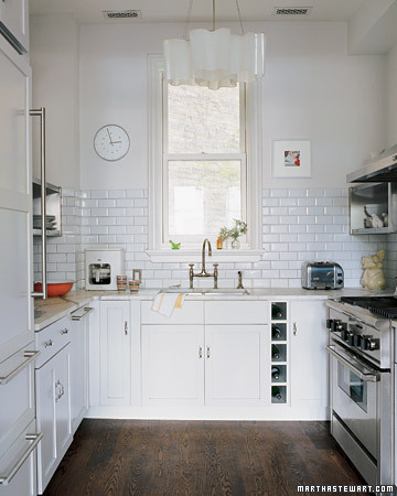 To achieve a feeling of openness, this Chicago row-house kitchen was washed in a clean, pale palette.