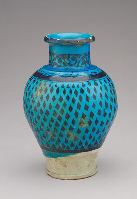 Jar | Origin:  Raqqa,  Syria | Period: late 12th-early 13th century | Details:  Before the devastating Mongol invasion in the mid-thirteenth century, the city of Rakka in northern Syria became an important ceramic center. This elegant jar is characteristic of one type of ware associated with Rakka. It is decorated with bold black designs under a transparent turquoise glaze that is often quite thickly applied and appears almost in relief. | Type: Stone-paste painted in black under turquoise glaze | Size: H: 31.1  W: 21.6  cm | Museum Code: F1908.136 | Photograph and description taken from Freer and the Sackler (Smithsonian) Museums.