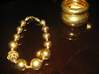 Necklace from Barrera and bracelets from Alexis Bittar.