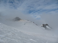 Weather starting to clear as we approach the saddle near the summit.