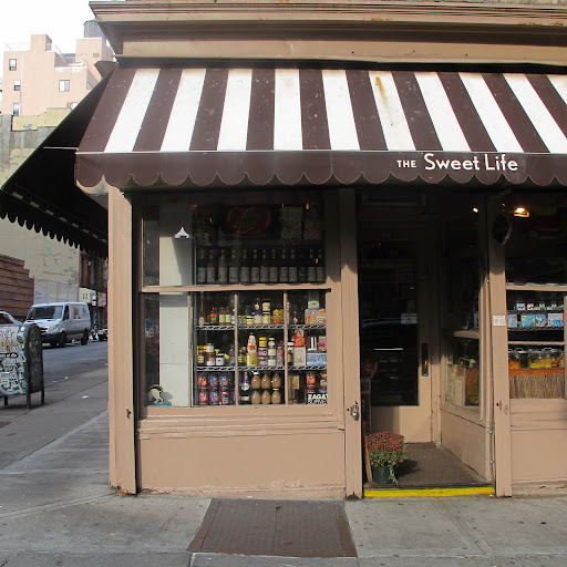 The quiet storefront of The Sweet Life just a few blocks away is a contrast to Economy's mass approach. The quiet storefront of The Sweet Life just a few blocks away is a contrast to Economy's mass approach.