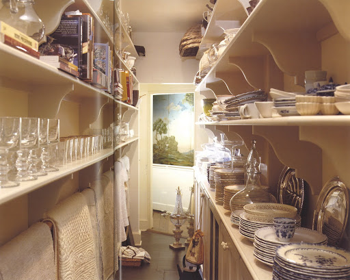 This space acts as the laundry room and pantry at Whilton Farm in the foothills of the Blue Ridge Mountains in Virginia. This previously unused passageway makes all items easily visible and reachable. This space acts as the laundry room and pantry at Whilton Farm in the foothills of the Blue Ridge Mountains in Virginia. This previously unused passageway makes all items easily visible and reachable.