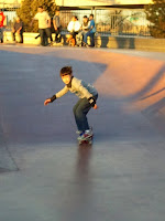 Kai at the Denver skate park, learning to ride