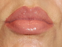 NYC New York Smooch Proof Lip Stain in Never Ending Nude with clear gloss on top.