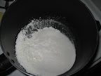 Cornstarch, granulated sugar, and salt are added to the saucepan.