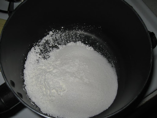 Cornstarch, granulated sugar, and salt are added to the saucepan.