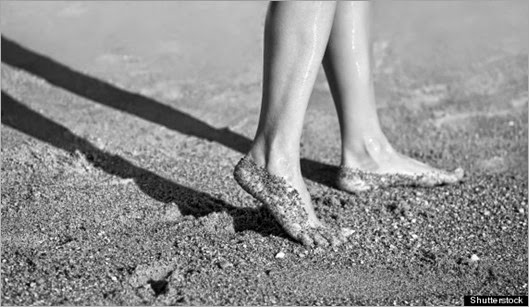 Girl's barefoot legs on the sand beach; Shutterstock ID 96465758; PO: aol; Job: production; Client: drone