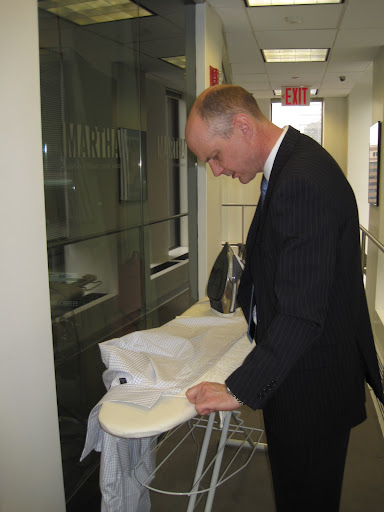 Lie the button placket down on top of a towel and iron the inside, to protect your buttons as well as your iron.