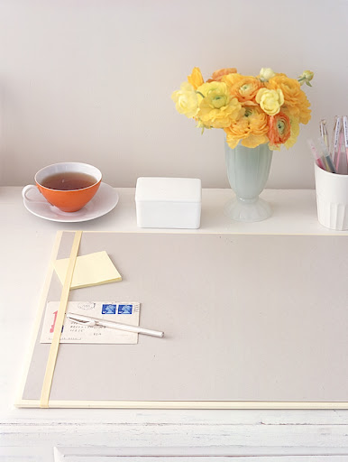 A blotter with an elastic strip is a good place to tuck your to-do list.