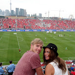 watching the match Toronto FC vs New England Revolution in Toronto, Ontario, Canada