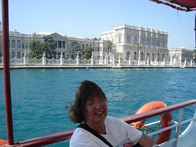 Day 3: Sonnie enjoying the Bosphorus cruise with the Dolmabahce Palace in the background