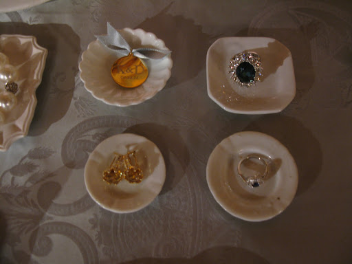 Clockwise from top left: brass boutonniere, Spring 2011 issue of Martha Stewart Weddings; costume copy of Diana and Kate's ring, Kenneth J. Lane; citrine and white topaz earrings, Emma Stine; vintage sapphire ring, Doyle & Doyle.