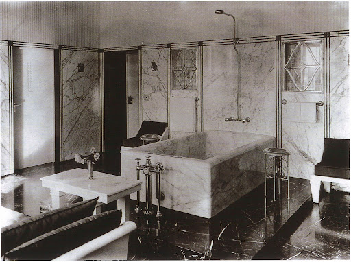 Hoffman used malachite and three different types of marble (statuario, black and bleu-belge) to create this amazing master bathroom. If this were mine I'd never leave.