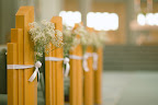 Small bundles of baby's breath decorated the church's pews.