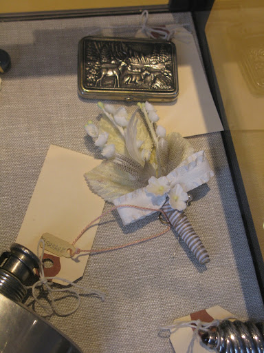 Mens accessories include this fun box for valuables and a fabric boutonniere