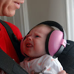 Trying on her sports headphones