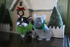 They're supposed to be Frenchies, but I think the one on the left is an imposture.  It looks like a Boston terrier to me.
