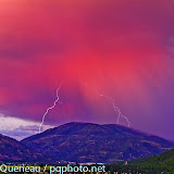 An August evening greets Bonner Mountain with two shocking lightshows at once.