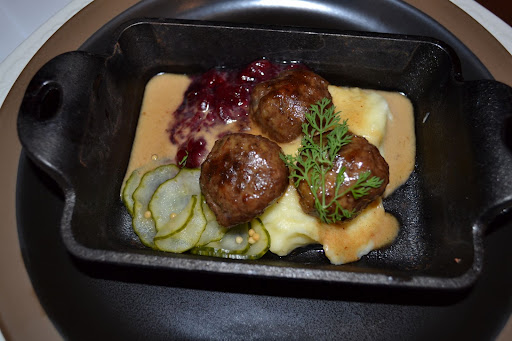 Helga's Meatlballs with Mashed Potatoes and Lingonberries and Pickles on the side. Helga's Meatlballs with Mashed Potatoes and Lingonberries and Pickles on the side.