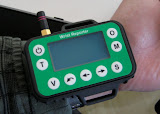 The Wrist Reporter shown in relation to a forearm, where it is typically mounted.