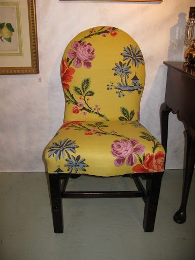 Martha and I really loved this chair.  It is Georgian in style and one of a pair.  Although the colors are bright and cheerful, I find the fabric distracts from the simple beauty of the silhouette and legs.  These came home with us.