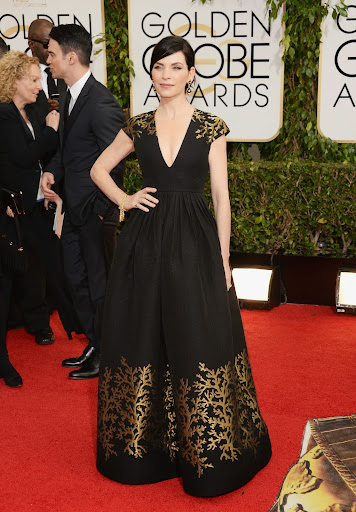 While ball gowns tend to overwhelm at events like an awards show and are best saved for a walk down the aisle, Julianna Marguiles wowed in a perfectly shaped v-neck gown by Andrew Gn. While ball gowns tend to overwhelm at events like an awards show and are best saved for a walk down the aisle, Julianna Marguiles wowed in a perfectly shaped v-neck gown by Andrew Gn.