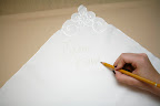 Step 1: With the pencil, trace out the guest's name and table number. It'll serve as your stitching guide.