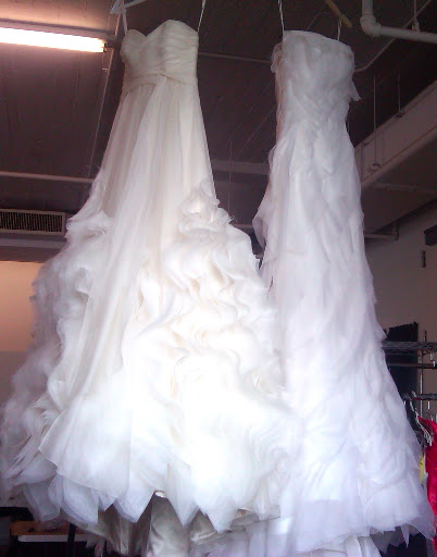 The best way to steam a wedding dress is to hang it from a high place. That way, the weighty skirt can flow free and help pull out any wrinkles.