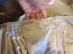 Originally, the skirt was going to be ivory, but they shifted plans to a mocha hue once the bodice was made. Two weeks out, Steven flew to NYC for a day to source additional fabric and then flew home to hand-pleat the skirt.