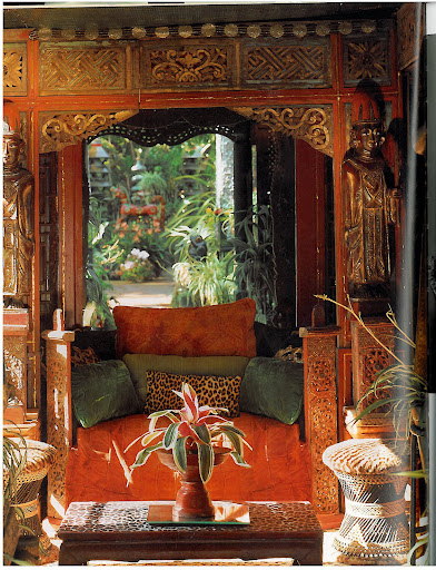 This intimate sitting room looks so inviting and warm.  The small daybed is made out of exotic carved wood from locales such as Bali, Thailand, India and China.  I love the basket-weave stools - they're upholstered with real leopard!