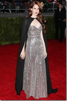 Lana Del Rey has worked her dark side with impressive results. Teaming a Joseph Altuzarra silver hand-embroidered gown with a black silk georgette cape