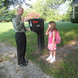 Abigail was so excited!  The bus was scheduled to arrive at 8:20, and she was up at about 7:20, watching out the door and asking when it would come.  To pass the time, she and Daddy played Rock, Scissors, Paper.