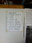 Handwritten sign on the barn fridge advertises the day's greens. Handwritten sign on the barn fridge advertises the day's greens.
