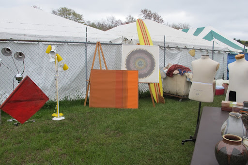 It's not uncommon to see a surfboard and tailor's forms together in one booth -- the mix is often unexpected.