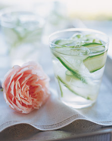 To make these cocktails, cucumber-infused vodka is garnished with cucumber ribbon and mixed with ginger simple syrup.