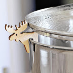 Last and littlest, but not least: I want Santa to please stuff this wooden cut-out moose in my stocking. Just perch him on the rim of a pot so steam can vent and say good-bye to overflows! (Little Pot Guard Critters, $7 each, http://www.solutions.com/)