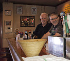 Earl Kelly, spouse of PDPLB member Kristine Kelly, poses with PDPLB member Spencer Langdon behind the bar at Curley's Cafe during the Progressive Dinner Party Long Beach fundraiser for Save Long Beach Unified School District Middle School Sports on June 5, 2011. Earl Kelly, spouse of PDPLB member Kristine Kelly, poses with PDPLB member Spencer Langdon behind the bar at Curley's Cafe during the Progressive Dinner Party Long Beach fundraiser for Save Long Beach Unified School District Middle School Sports on June 5, 2011.