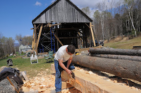 Seth hews the last face of a sill timber.