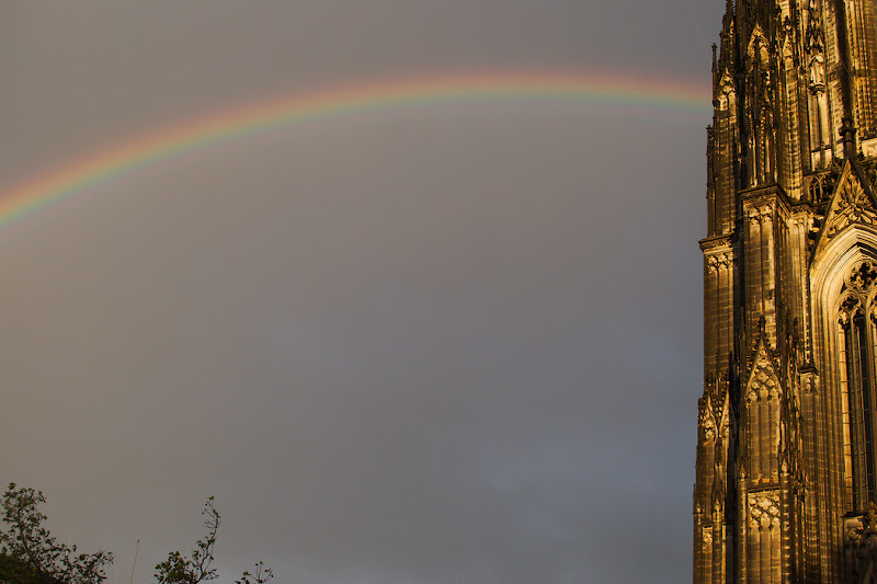 A rainbow after an autumn rain pierces the austere walls of the Cologne Cathedral.