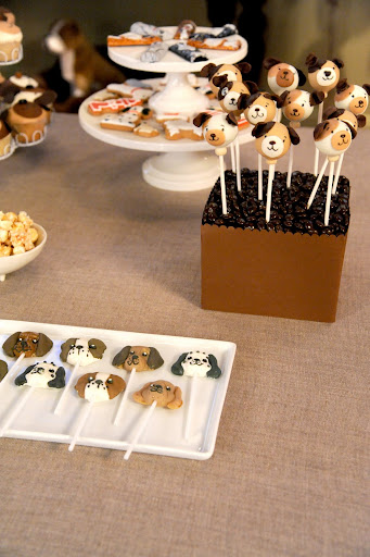 On the cakestand are chocolates from Supreme Chocolatier and cookies from Eleni's. The puppy cake pops are from Cake Power and the dog lollipops below are from Oriental Trading.