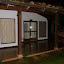 The front door and patio. Hammock on the right.