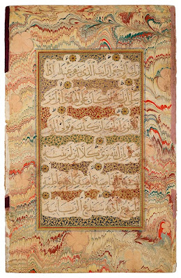 Qur˒anic Leaf from the Read Persian Album From the Read Persian Album. Probably from the Deccan (Golconda), late sixteenth century. On paper. Sometimes beautifully written and framed Qur˒anic passages were preserved in albums. This magnificent leaf originally must have faced a page that began with Muḥammad's first revelation (610), sura 96.1—5 (Iqraa, or "Read!" or "Proclaim"), also known as al-˓Alaq ("The Clot of Congealed Blood"), as the present leaf contains verses 8–18. The names come from the verses: Read! (or Proclaim) in the name of your Lord and Cherisher, Who created—created man, out of a [mere] clot of congealed blood. . . .Proclaim . . . He Who taught [the use] of the pen. The six lines of muḥaqqaq script contain ten short ayat (verses), each ending with a gold rosette. Marbling (abri, or "clouds," in Persian) was known in Persia by the sixteenth century, when named abri masters are documented.
