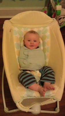 half swaddled in rock n play to sleep