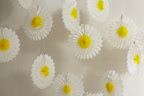 I strung up these festive tissue daisies (in the sale) when I had my daughter’s first birthday party. I really love how they turn any space into an instant party. 
You can string them into one garland, or hang them individually at different lengths for a cute daisy effect.