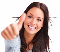 Portrait of attractive young female showing a thumbs up on white background Portrait of attractive young female showing a thumbs up on white background