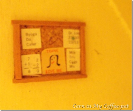 BULLETIN BOARD UNDER THE STAIRS-