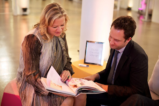 Claudia Hanlin of The Wedding Library and Matthew Robbins of Matthew Robbins Designs sit on the 